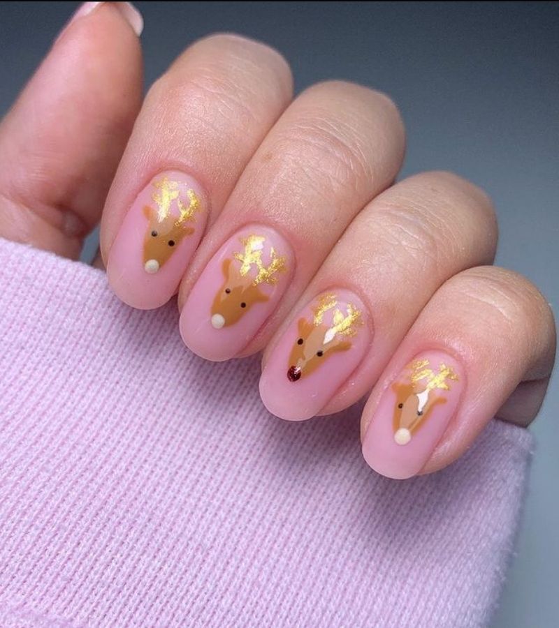 Nude Pink Nails With Golden Reindeers - Cute Christmas Nail Designs