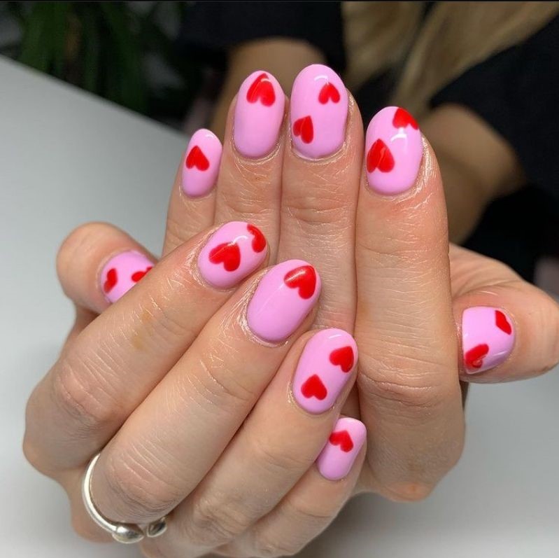 Pink base with floating red hearts - nails with heart design