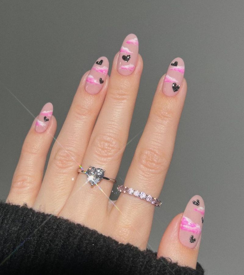 Pink clouds nails with black hearts - cute valentines nails 