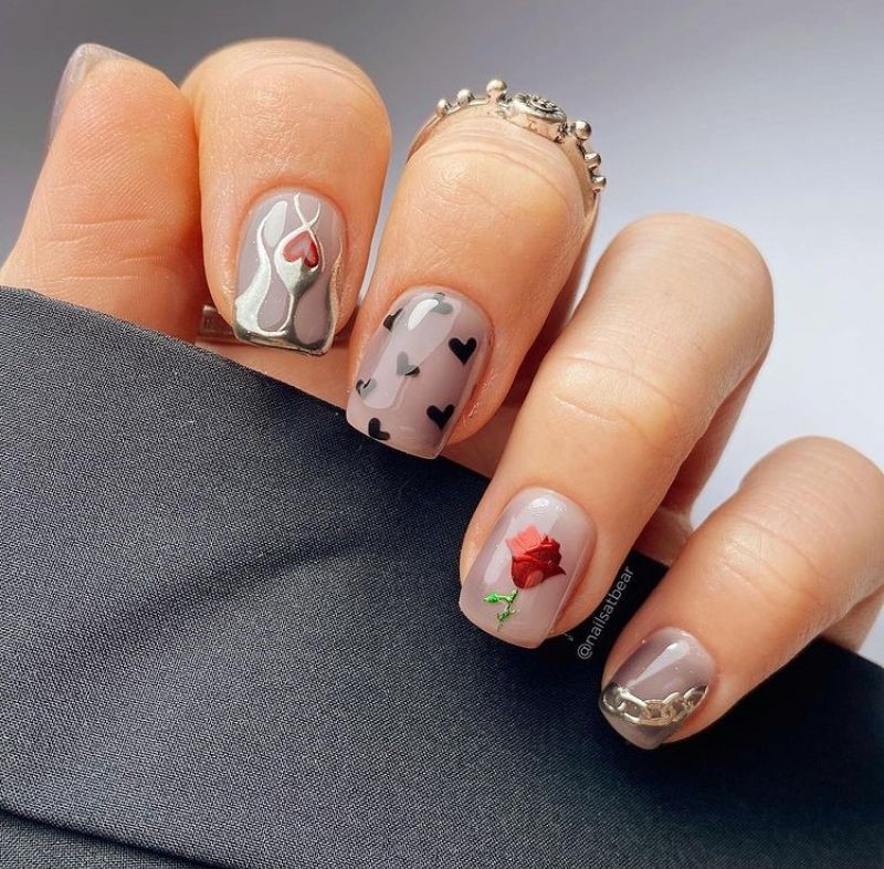 Goth nails with black hearts, a rose and grey base - cute valentines nails