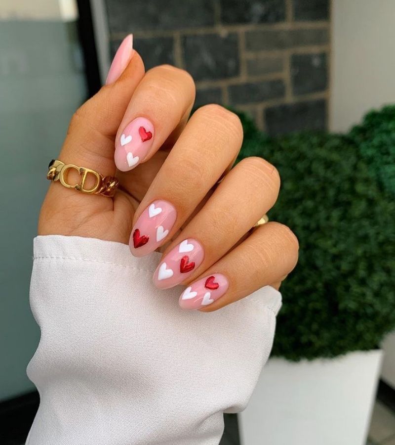 Pink base with red and white hearts - nails with heart designs