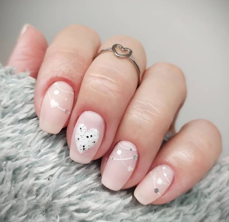 Light pink with white hearts and garlands - cute valentines nails