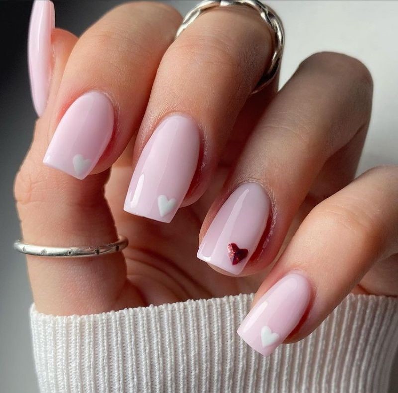 Light pink with a single heart at the end - cute valentines nails