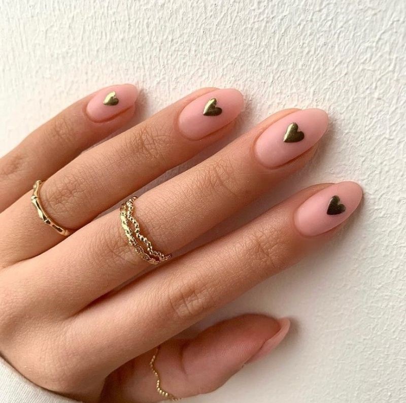 Pastel Pink With A Single Gold Heart - simple heart nail designs