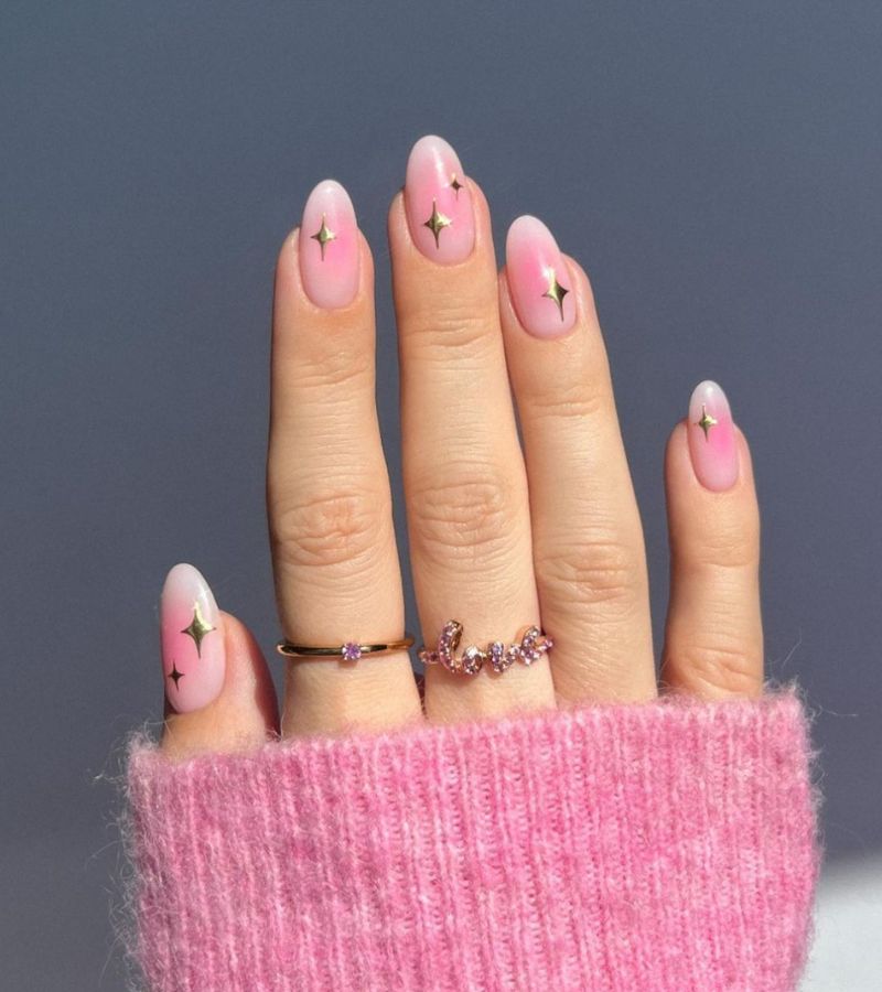 Pink blushing nails with gold sparkles 