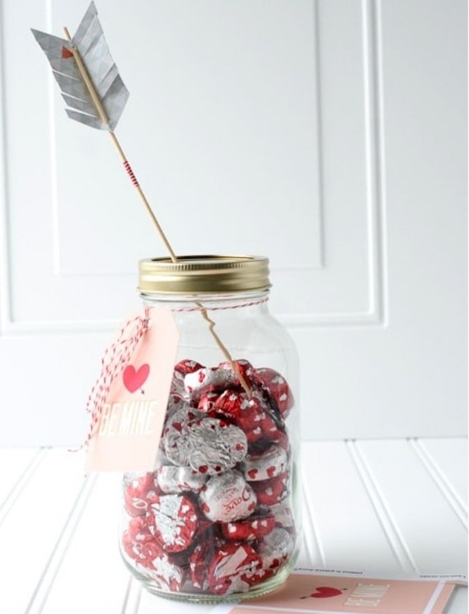 Cute DIY Valentine's Day gifts for her - mason jar with red and white heart shaped chocolates