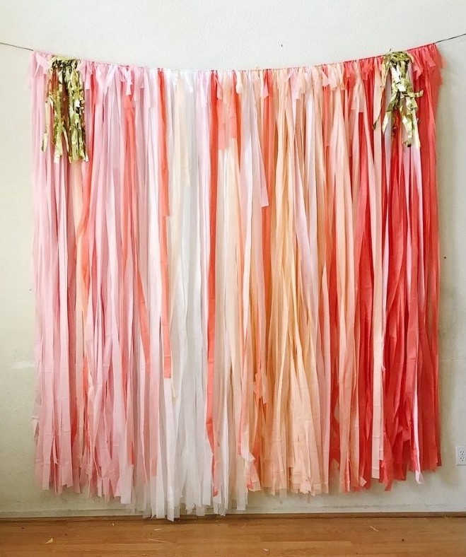 Pink and white fringe backdrop - graduation photo booth ideas