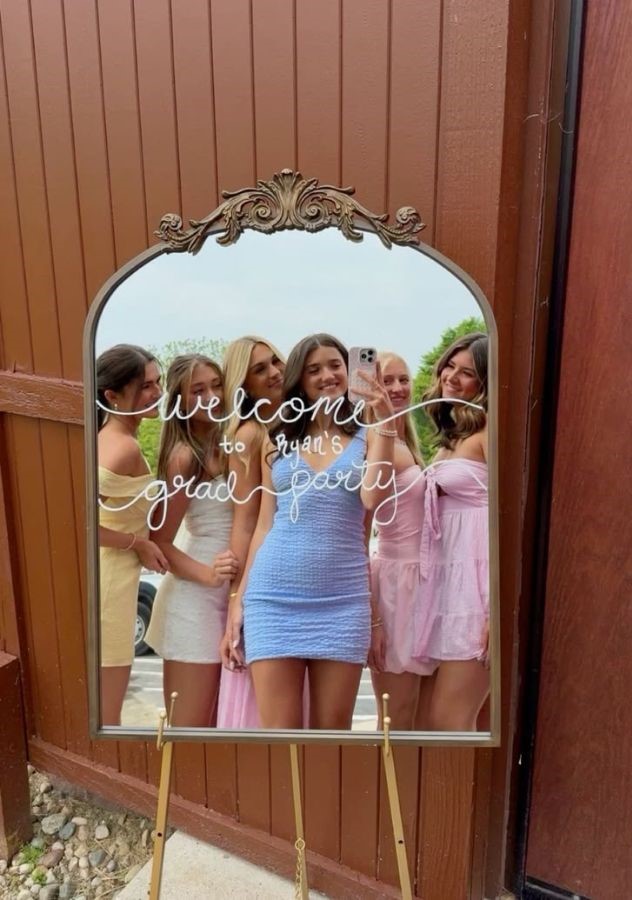 4 girls taking mirror selfie