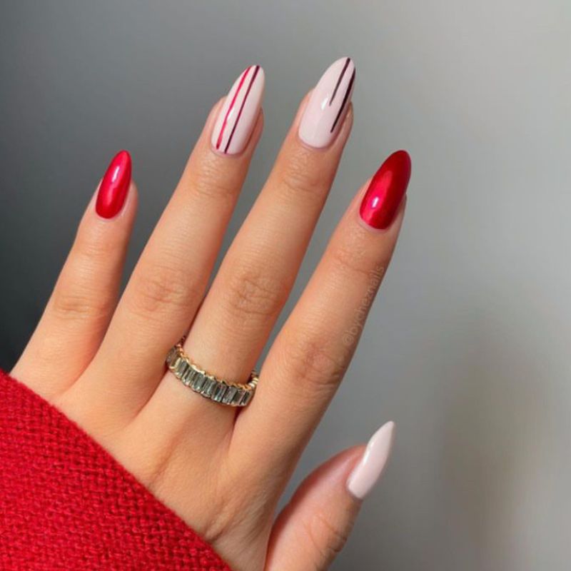 Red and white nails with straight lines across white