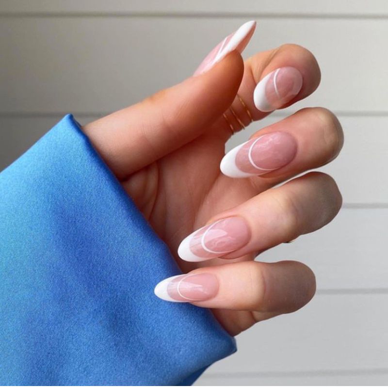 white French nails with a white arch 