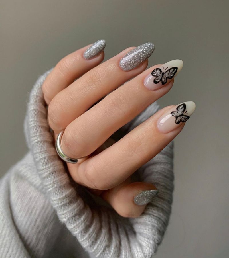 Silver nails with butterfly accent