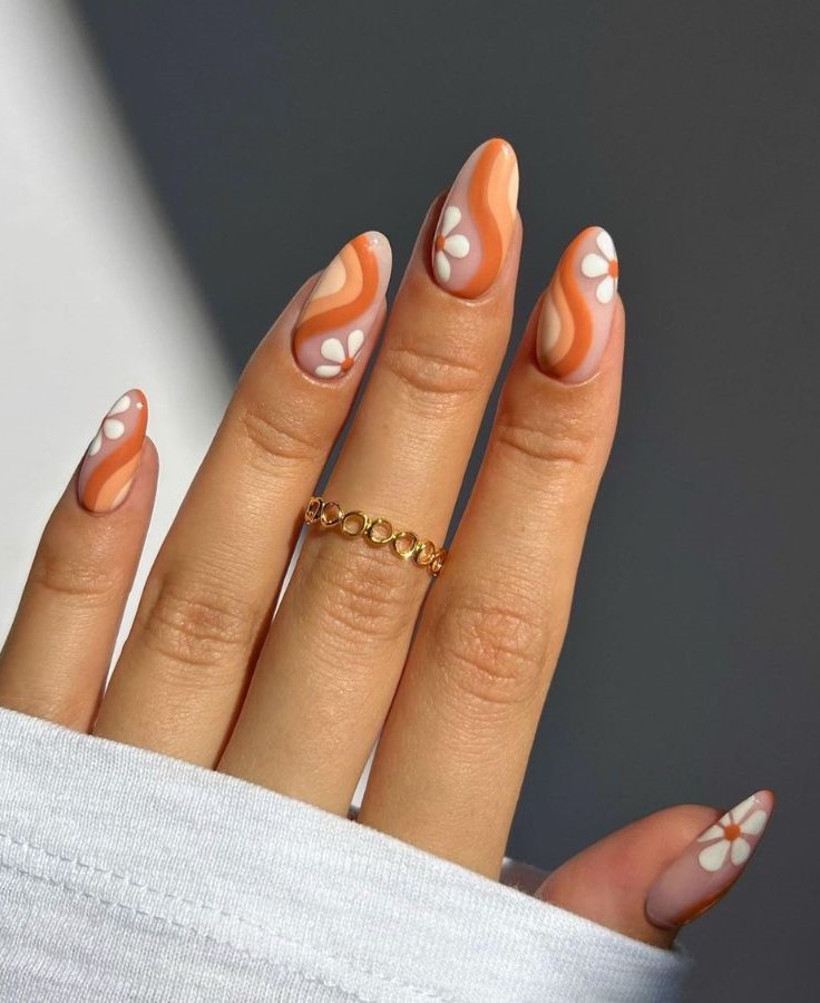 swirly orange with white fall floral nails 