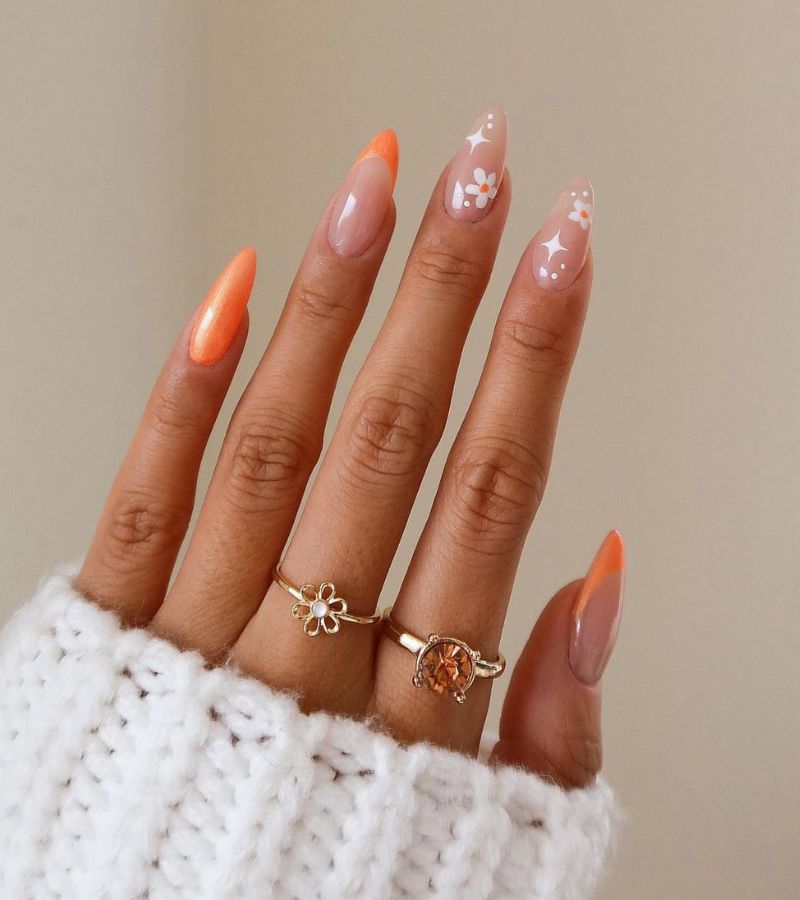 orange color nails with white florals