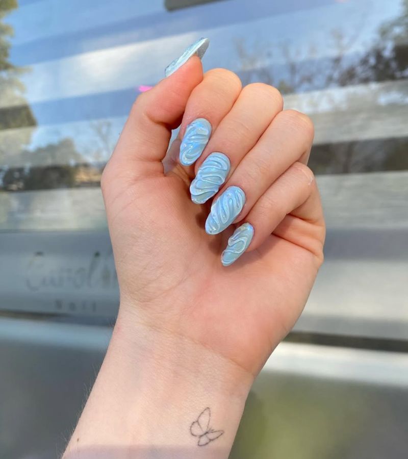 baby blue nails with 3d swirls 