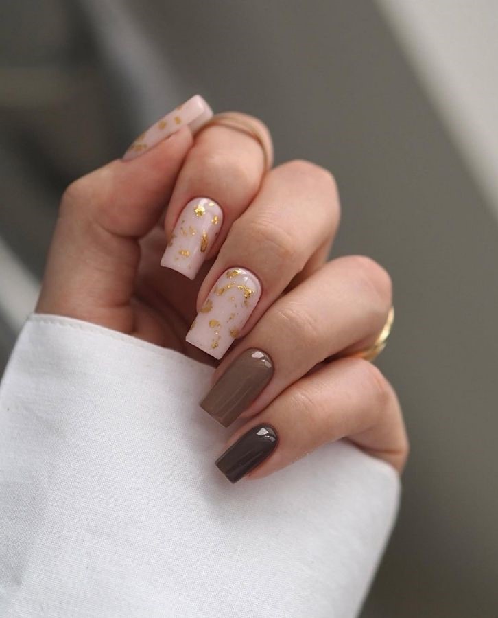 brown mocha nails with gold flakes