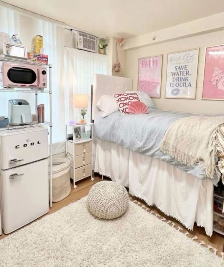 vibrant dorm space with coral and turquoise decor, beach posters, and layered pillows
