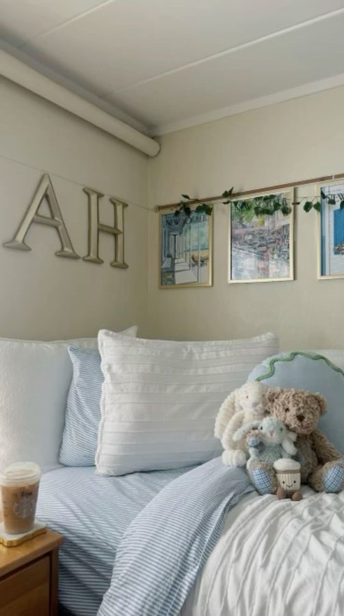 Twin XL bed with soft blue and white coastal dorm room ideas