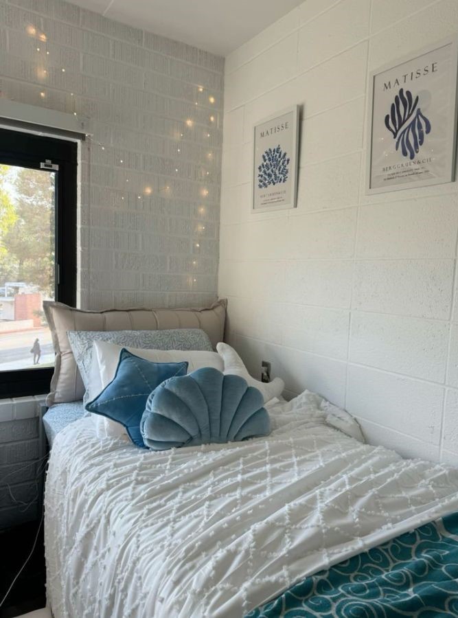 white dorm bed styles with pastel seashell pillows and dreamy beach accents