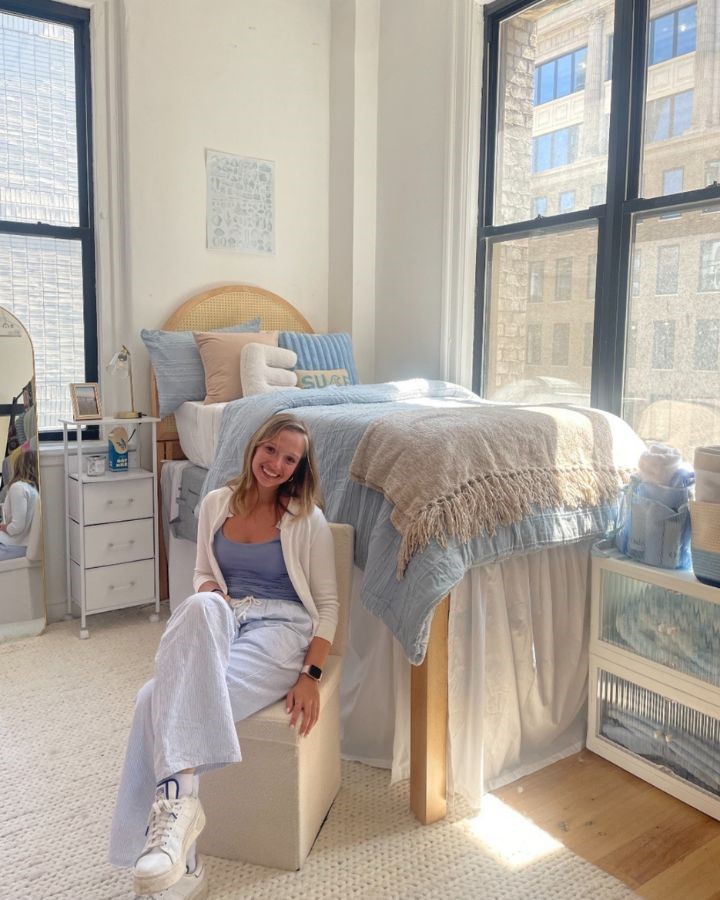 minimal coastal dorm room with blue and beige decor and coastal bedding