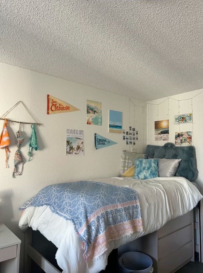 laid-back dorm wall with photo collage, beach pennants, and travel postcards
