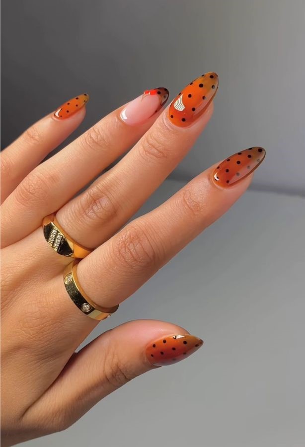 glossy orange polka nails