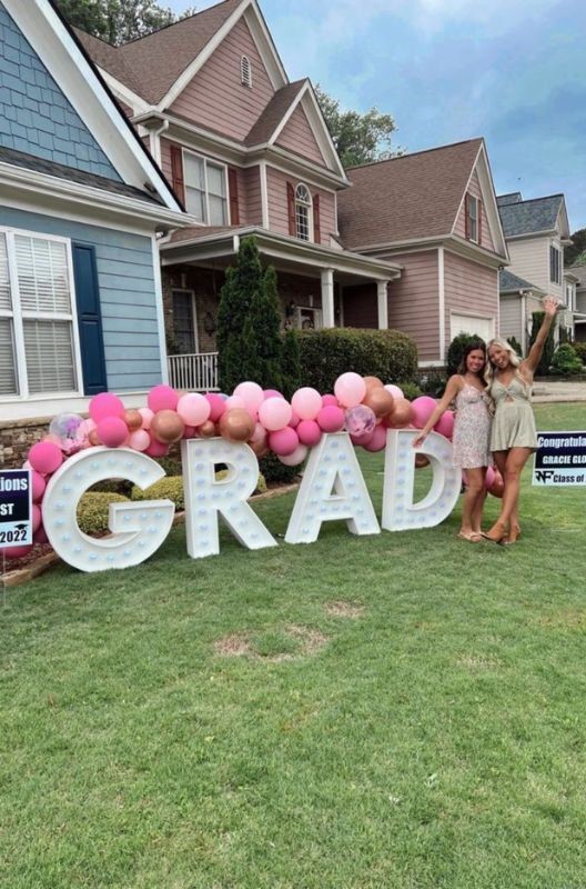 huge grad sign in the backyard graduation party ideas
