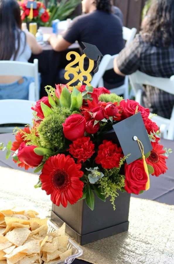 bold floral vase with year and graduation cap