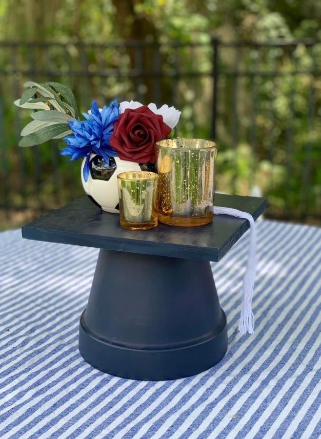 graduation cap with florals and candles