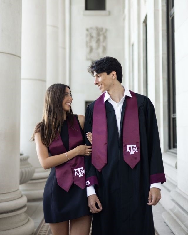 2 grads gazing at each other